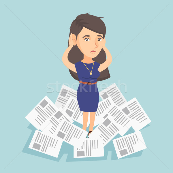 Stressed business woman having lots of work to do. Stock photo © RAStudio