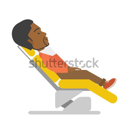 Man lying in dentist chair. Stock photo © RAStudio