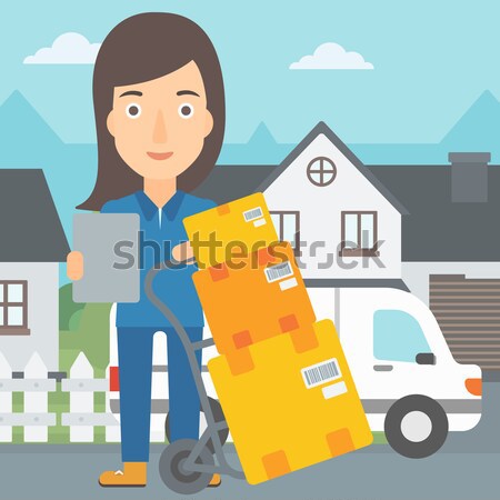 Delivery woman with cardboard boxes. Stock photo © RAStudio