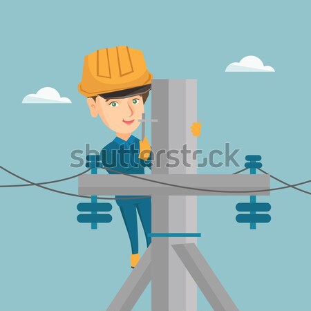 African electrician working on electric power pole Stock photo © RAStudio