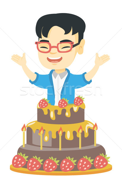 Little asian boy jumping out of a large cake. Stock photo © RAStudio
