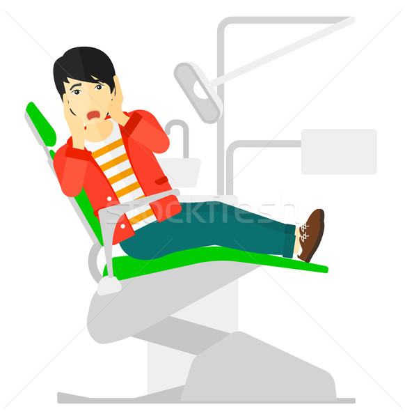 Frightened patient in dental chair. Stock photo © RAStudio