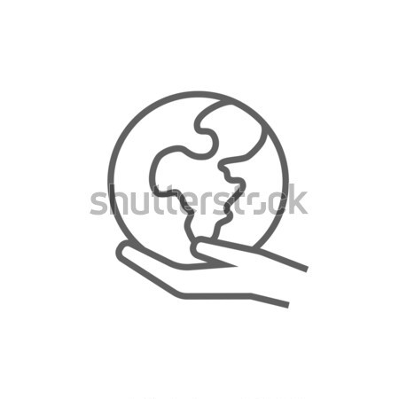 Hand holding the Earth line icon. Stock photo © RAStudio