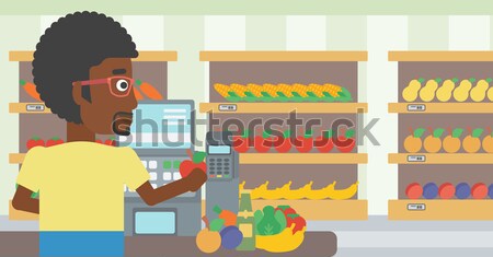 Cashier at supermarket checkout. Stock photo © RAStudio