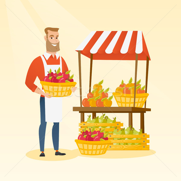 Stock photo: Greengrocer holding box full of apples.