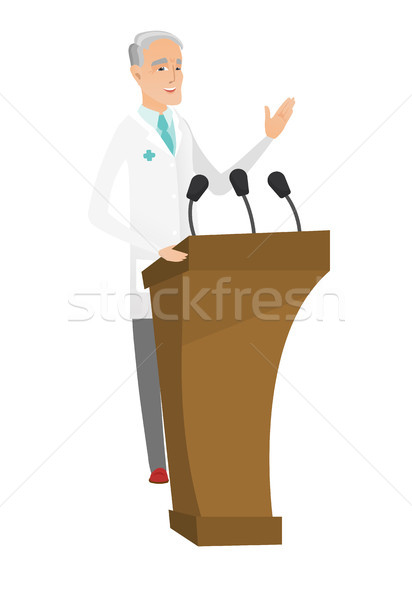 Caucasian doctor giving a speech from tribune. Stock photo © RAStudio