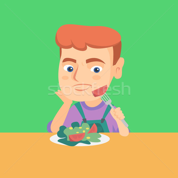 Boy refusing to eat salad with healthy vegetables. Stock photo © RAStudio