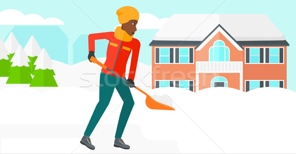 Woman shoveling and removing snow. Stock photo © RAStudio