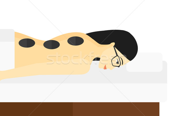 Woman getting stone therapy. Stock photo © RAStudio