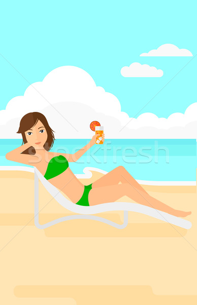 Stock photo: Woman sitting in chaise longue.