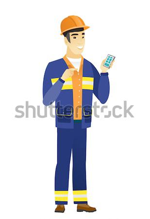 Asian builder showing palm hand. Stock photo © RAStudio