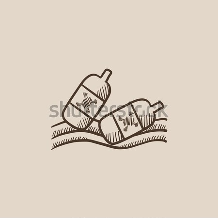 Bottles floating in water sketch icon. Stock photo © RAStudio