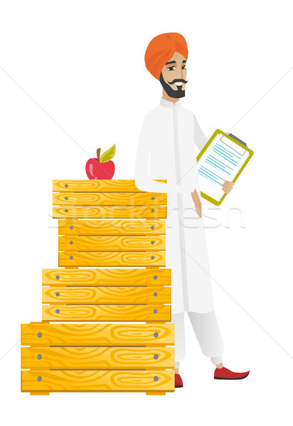 Farmer holding clipboard with documents. Stock photo © RAStudio