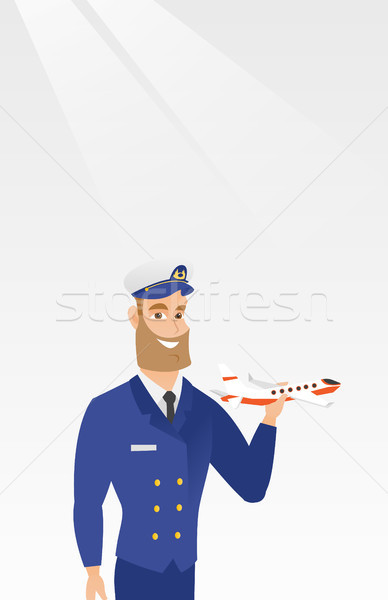 Vrolijk vliegmaatschappij piloot model vliegtuig jonge Stockfoto © RAStudio