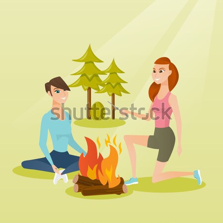 Deux amis séance autour feu de joie camping [[stock_photo]] © RAStudio