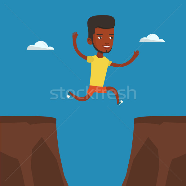スポーツマン ジャンプ 崖 ギャップ 1 岩 ストックフォト © RAStudio