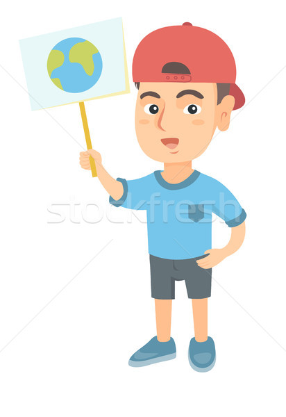 Caucasian boy holding a placard with planet. Stock photo © RAStudio