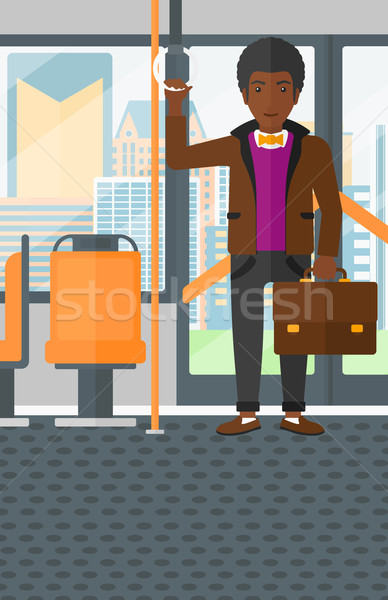 Man standing inside public transport. Stock photo © RAStudio