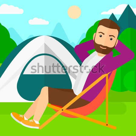 Man sitting in folding chair. Stock photo © RAStudio