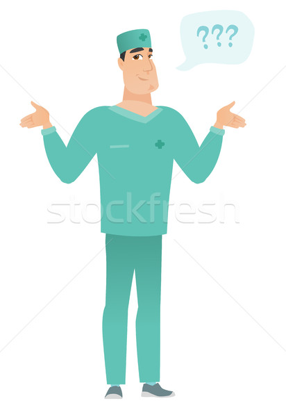 Stock photo: Caucasian confused doctor with spread arms.