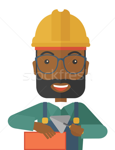 Black Mason man with trowel in hand Stock photo © RAStudio