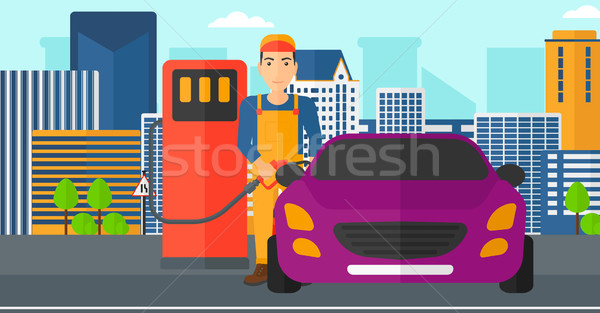 Hombre relleno hasta combustible coche ciudad Foto stock © RAStudio