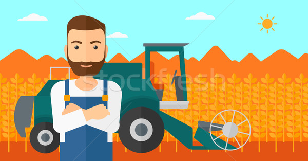 Man standing with combine on background. Stock photo © RAStudio
