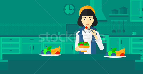 Woman eating salad. Stock photo © RAStudio
