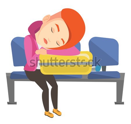 Exhausted woman sleeping on suitcase at airport. Stock photo © RAStudio