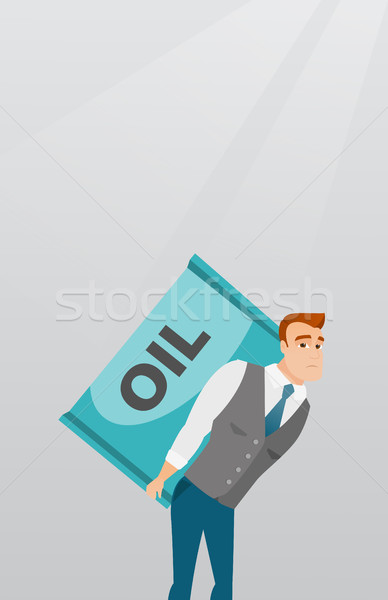 Business man carrying oil barrel on back. Stock photo © RAStudio