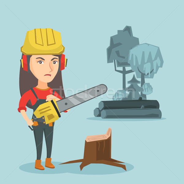 Young caucasian lumberjack holding a chainsaw. Stock photo © RAStudio