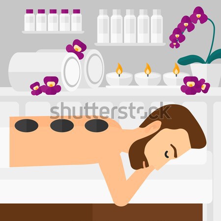 Woman getting stone therapy. Stock photo © RAStudio