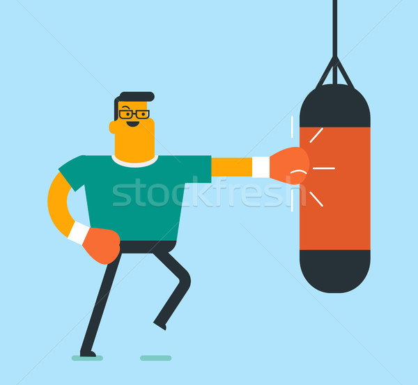 Caucasian white boxer hitting a boxing bag. Stock photo © RAStudio