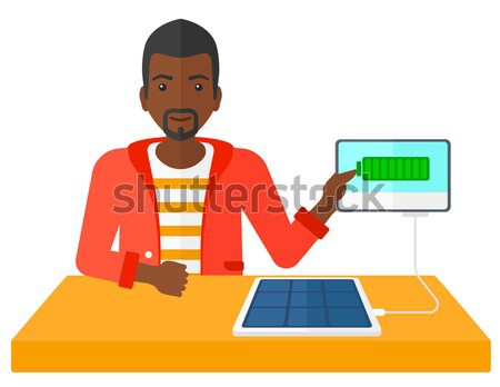 Solar panel charging tablet computer. Stock photo © RAStudio