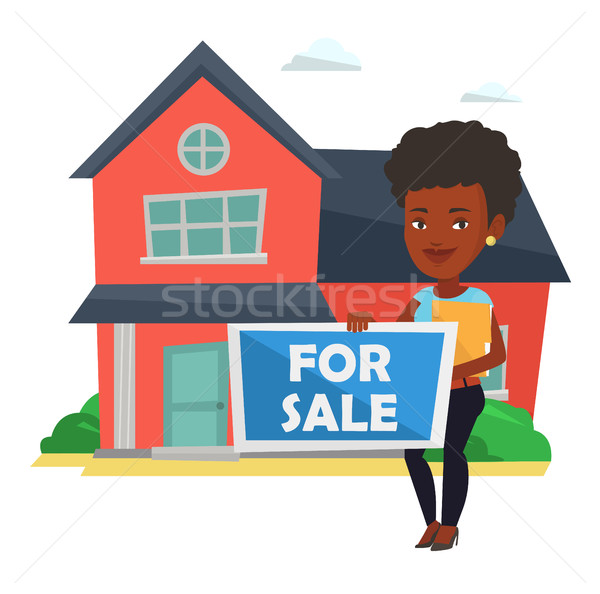 Stock photo: Young african-american realtor offering house.