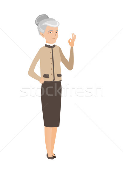 Senior caucasian business woman showing ok sign Stock photo © RAStudio