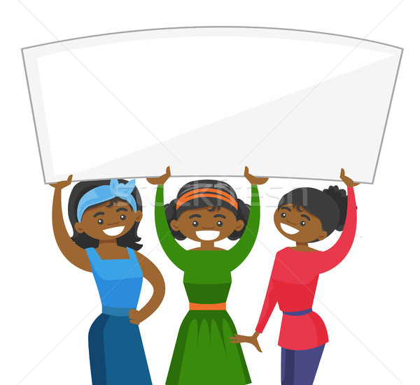 Group of young women holding white blank board. Stock photo © RAStudio