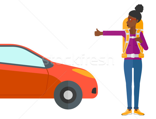 Young woman hitchhiking. Stock photo © RAStudio