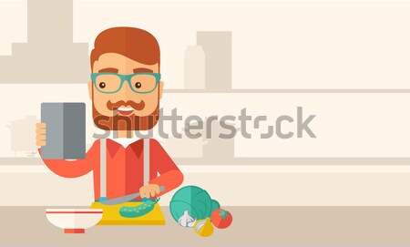 Young caucasian is eating salad for lunch in the restaurant. Stock photo © RAStudio