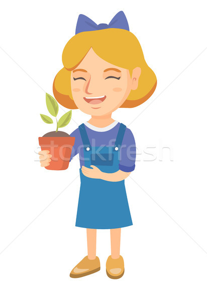 Caucasian smiling girl holding a potted plant. Stock photo © RAStudio