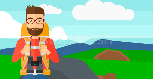 Cheerful backpacker with binoculars. Stock photo © RAStudio