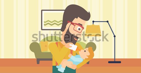 Father feeding baby. Stock photo © RAStudio