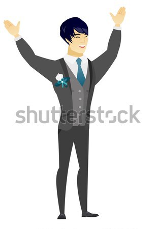 Groom standing with raised arms up. Stock photo © RAStudio