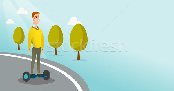 Man riding on self-balancing electric scooter. Stock photo © RAStudio