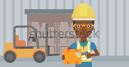 Warehouse worker scanning barcode on box. Stock photo © RAStudio
