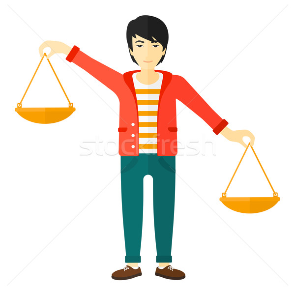 Businessman with scales. Stock photo © RAStudio