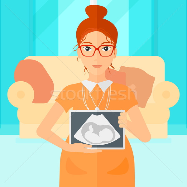 Pregnant woman with ultrasound image. Stock photo © RAStudio