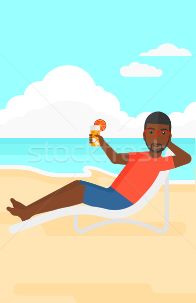 Man sitting in chaise longue. Stock photo © RAStudio