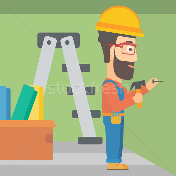 Constructor hammering nail. Stock photo © RAStudio