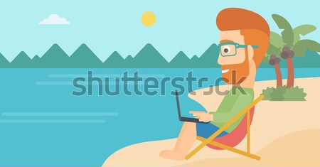 Stock photo: Businessman sitting in chaise lounge with laptop.